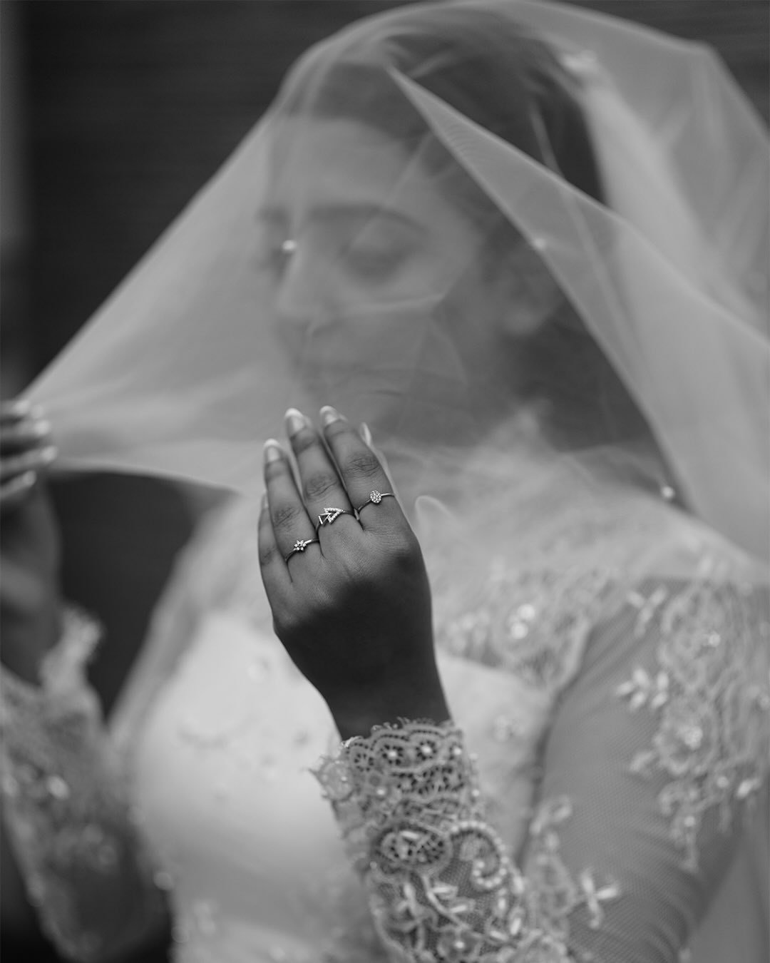 Newlyweds sharing a playful moment outdoors