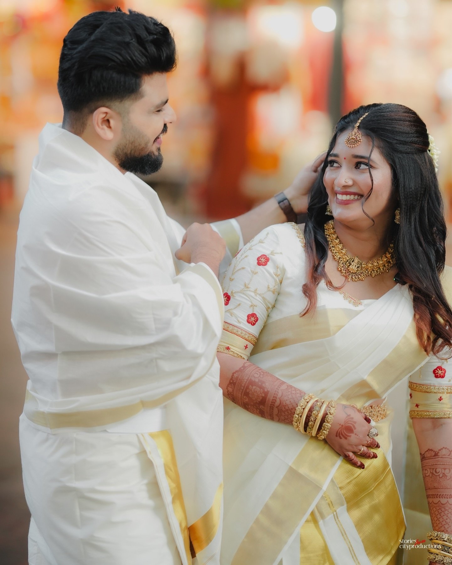 Couple walking together in traditional wedding attire