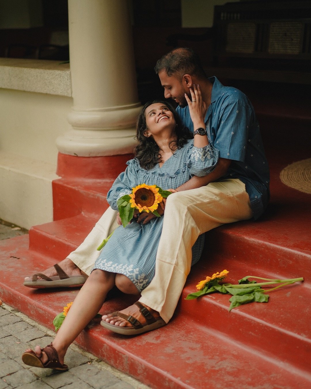 Bride smiling beside the groom and her bouquet